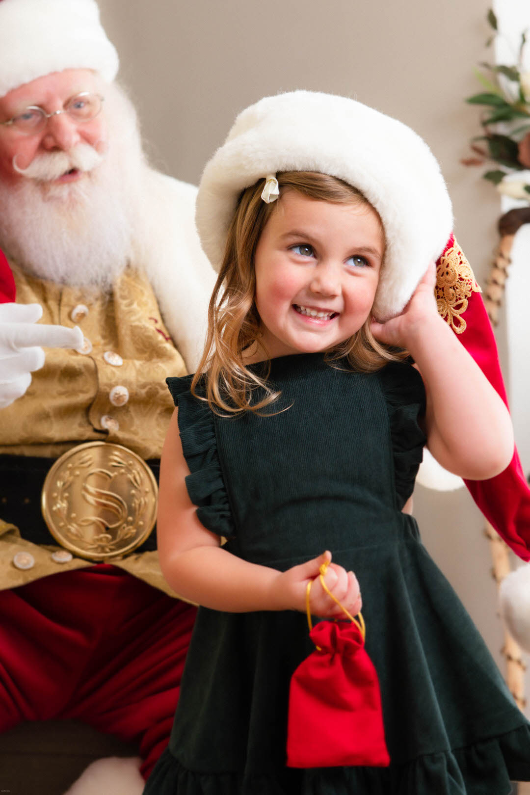 Child smiling with glee after meeting Santa Claus