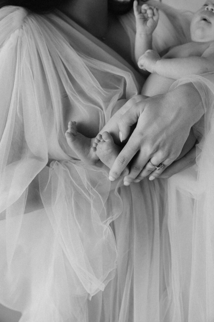 close up shot of mom holding her newborn in her arms